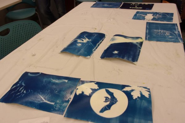 Students at a Youth-In-Custody facility participated in a two day art-science workshop creating cyanotype paper and then adding designs to their paper using stencils and exposure to sunlight.