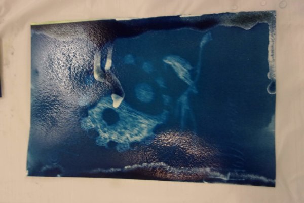 Students at a Youth-In-Custody facility participated in a two day art-science workshop creating cyanotype paper and then adding designs to their paper using stencils and exposure to sunlight.
